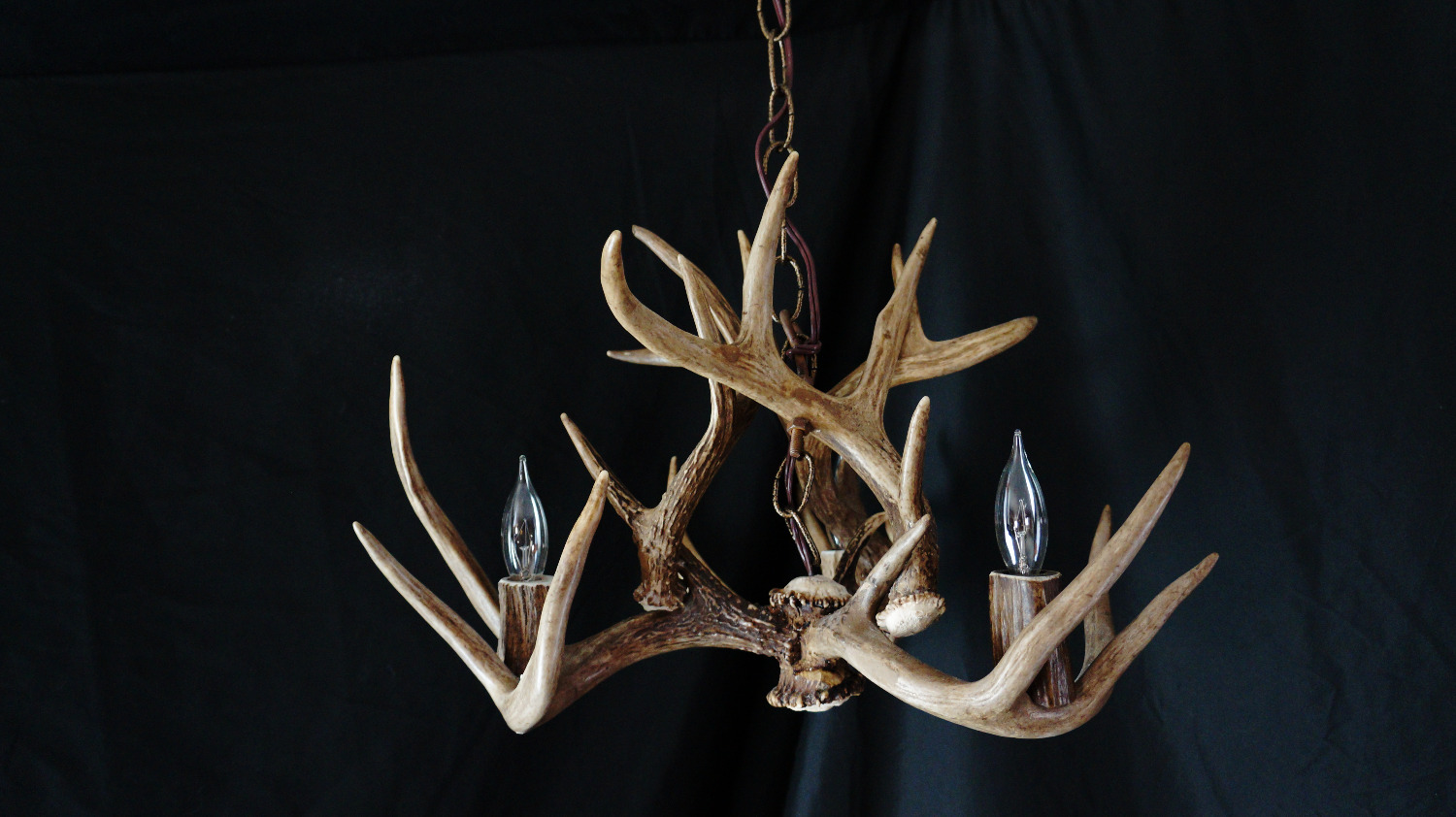 Spiral whitetail antler chandelier with candle-style bulbs